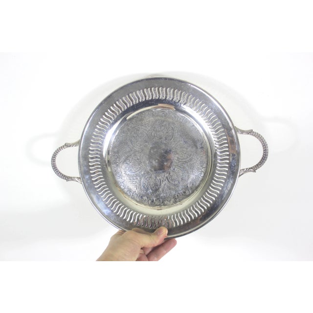 Small vintage silver plated tray with gorgeous pierced detail. This also has detailed handles. In good vintage condition...
