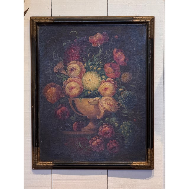 A richly colored floral still life with roses, peonies, chrysanthemums and other blooms spilling from a classical urn...