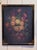 A richly colored floral still life with roses, peonies, chrysanthemums and other blooms spilling from a classical urn...