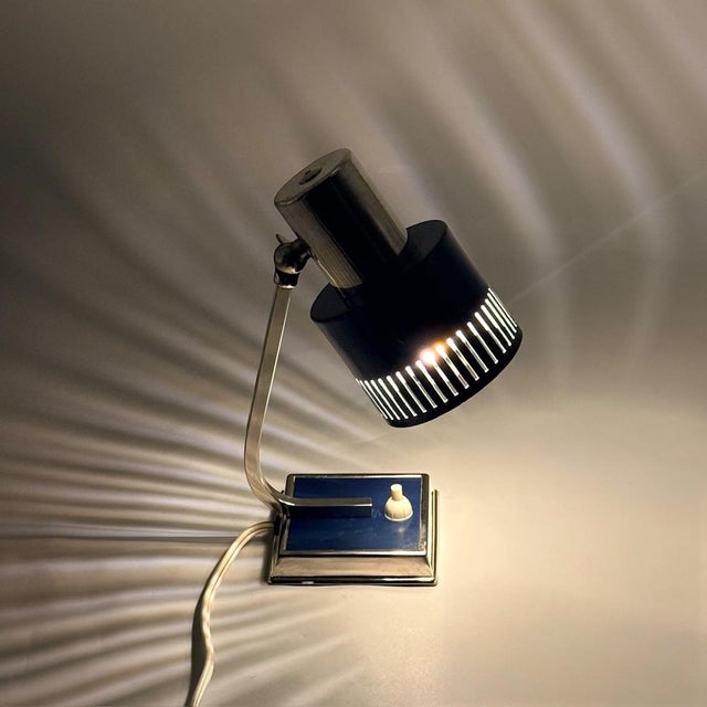 Vintage desk lamp produced in Italy in the 1970s, featuring a chromed metal structure and a blue lacquered cylindrical...