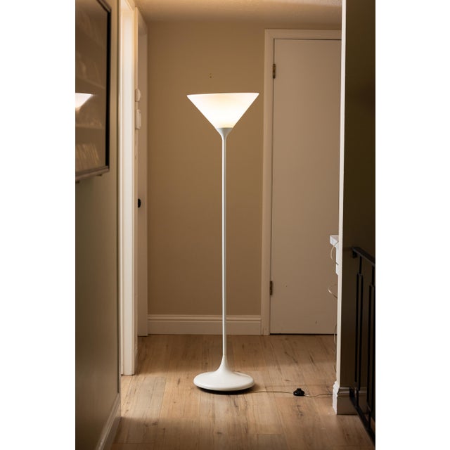Striking postmodern torchiere lamp by Koch + Lowy with a sculptural tulip-style base and frosted conical glass diffuser....
