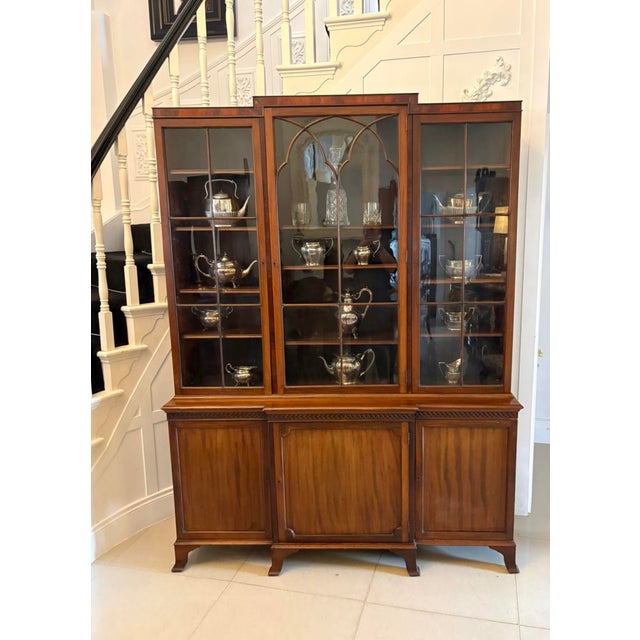 A handsome Edwardian mahogany breakfront bookcase with an elegant architectural shape and very useful proportions. The...