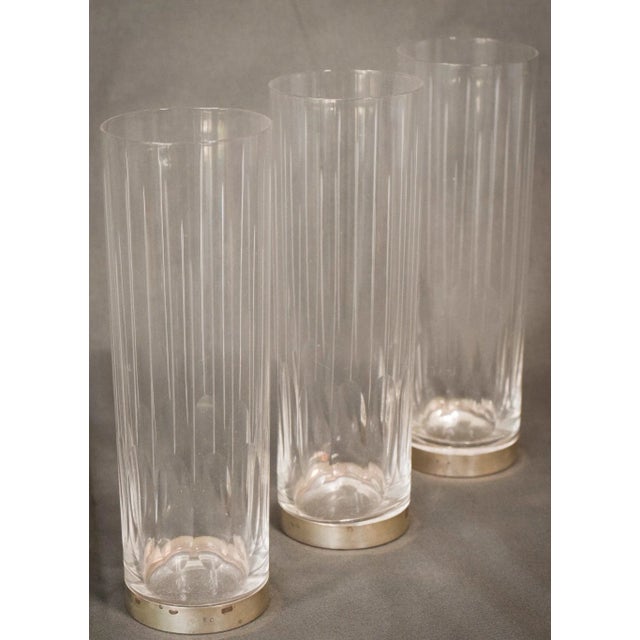 A highly unique set of six vintage drinking glasses. With ridged glass and silver bases, the tall, slim design adds to the...