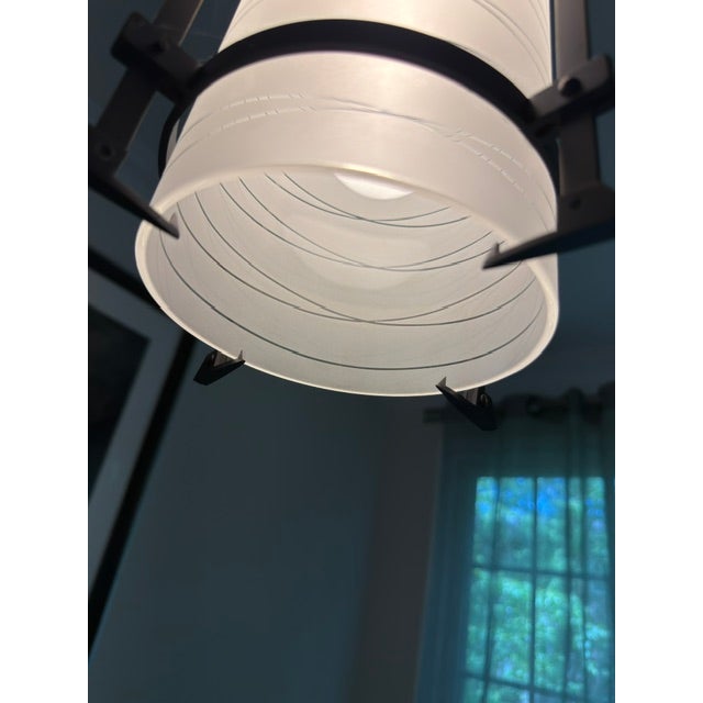 A striking pair of luxury architectural HOLLY HUNT lantern pendants, featuring a refined industrial silhouette in...