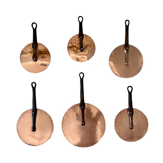 Fabulous set of six vintage French flat copper lids or "lollipop lids" in varying sizes. These classic kitchen utensils...