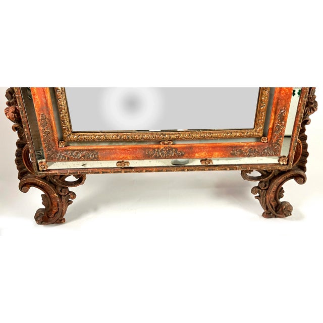 Hand-crafted in Italy in the early 1800s, this pair of polychrome Venetian mirrors have gilded carvings offset by floral...