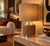 Original vintage lamp combining a chromed aluminum and natural cork cylindrical base with a dark beige mottled fabric...