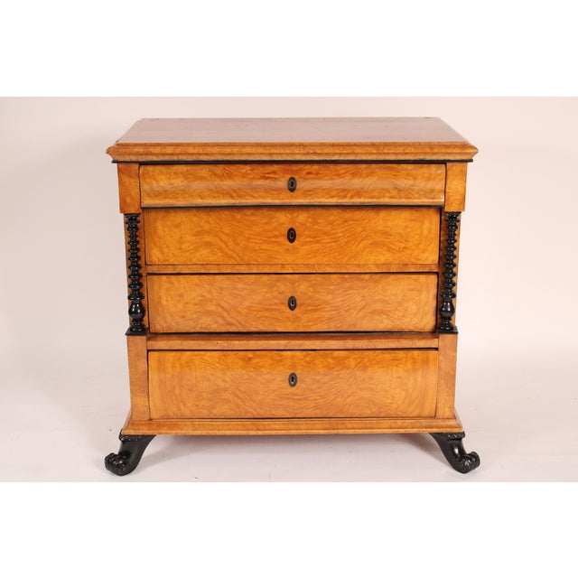 Antique Biedermeier style birch chest of drawers with ebonized highlights, 19th century. With a rectangular top with...