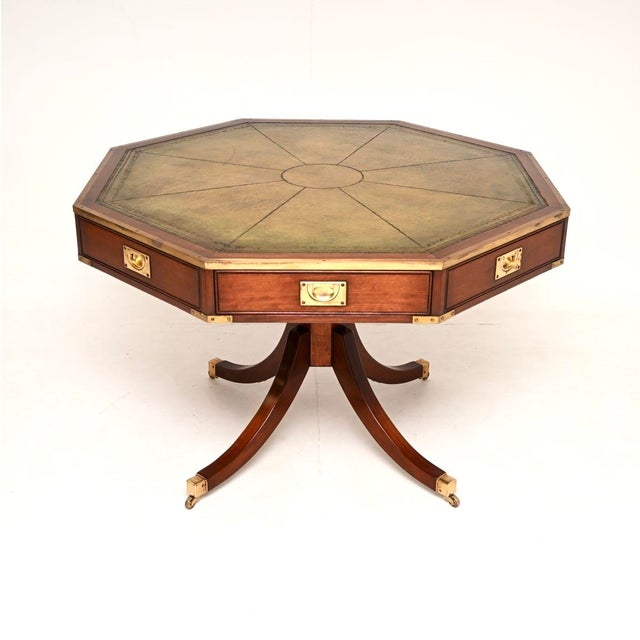 A smart and extremely well made large antique military campaign leather top drum table. This was made in England, we would...