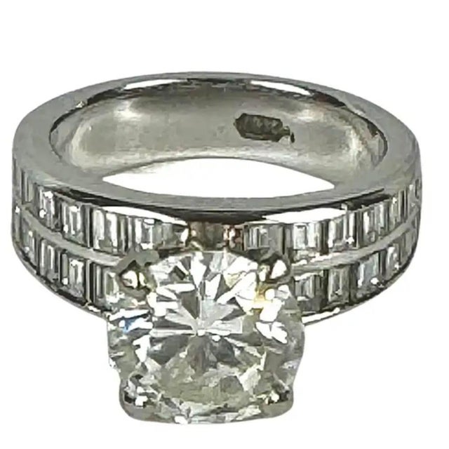 18 Karat White Gold, Diamond Ring Set with one round brilliant diamond approximate color I, clarity I F weighing...