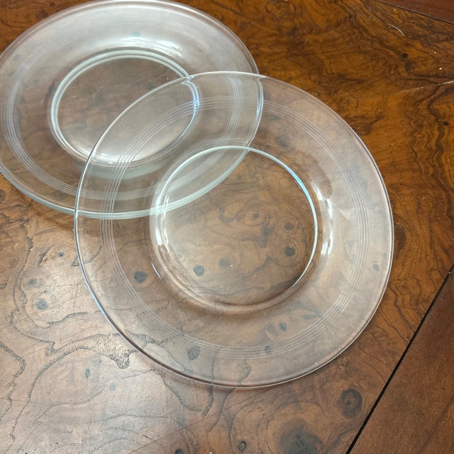 7” salad plate made by the Fostoria Glass Company in their #818 etched Formality band pattern. This pattern was made from...