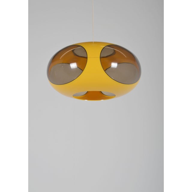 Space age pendant lamp in the shape of a ufo from the 1970s. This lamp is also called the 'bug eye' lamp and was produced...