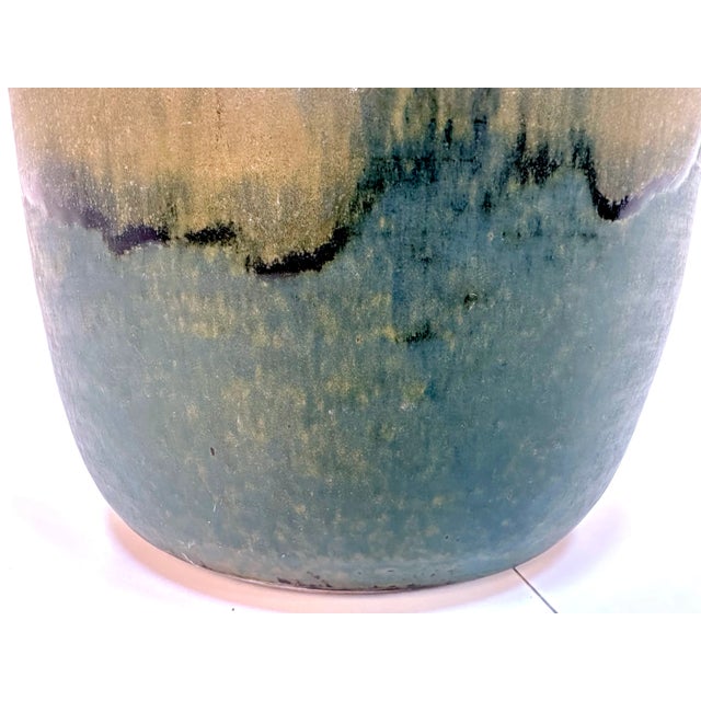 This large high-quality floor vase was hand-crafted at a studio of an unknown artist in Germany. The piece features a...