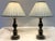 Great pair of vintage wood table lamps from the late 20th century. These have an ebony finish with delicately painted in...