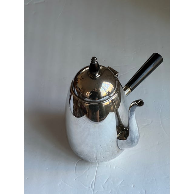Silver-plate hot chocolate pot with a wood handle and a knob on top. This is a beautiful piece to serve coffee or hot...