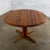 Handsome Mid-20th Century Scandinavian Modern solid teak round to oval expanding dining table with 2 leaves by Glostrup...