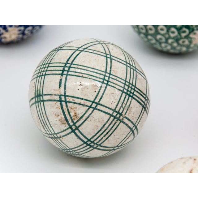 A set of 6 Scottish Carpet Balls in green, red, blue, and solid white. The white one is x 3" in diameter, and the...