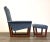 A mid century modern blue-grey upholstered lounge chair and ottoman with a teak frame. Seat height is 16”. 32.5” wide....