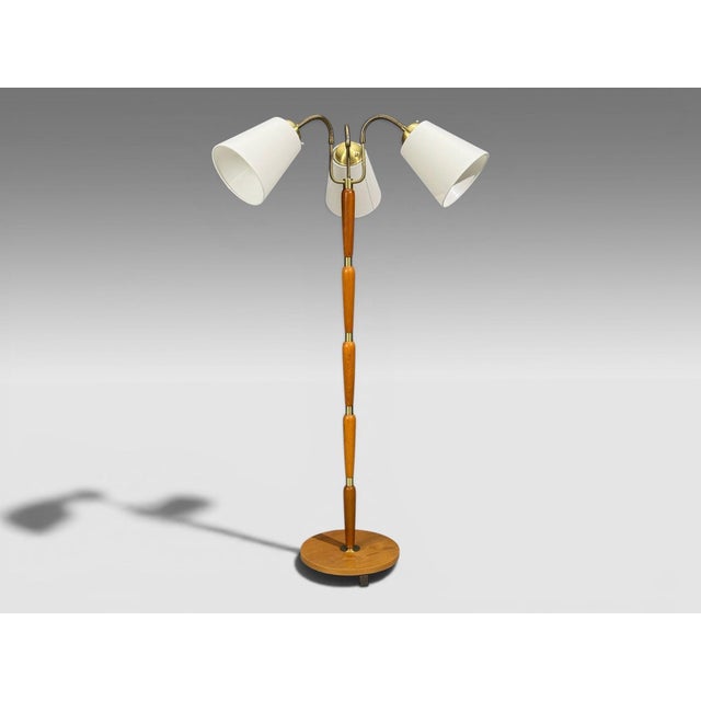 Swedish Mid-Century Modern, Three Arm Floor Lamp, Stained Wood, Fabric, Sweden, 1950s A unique three arm Scandianvian...