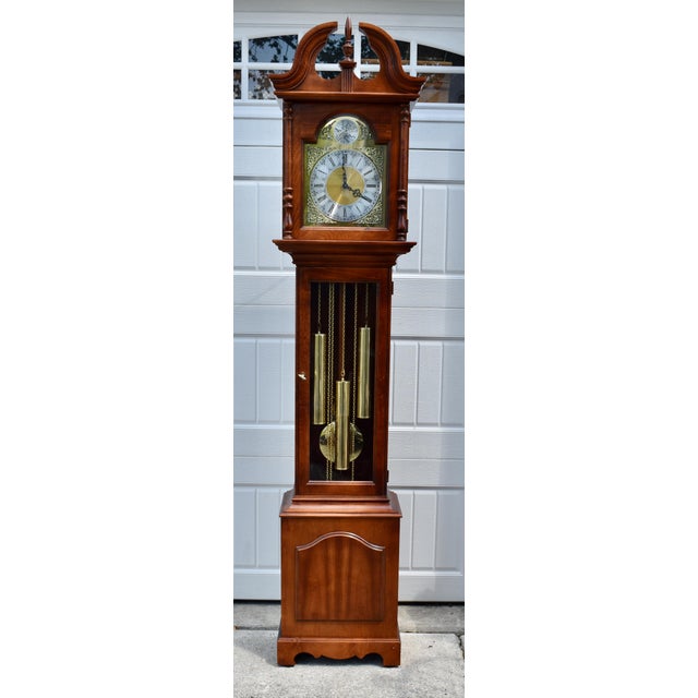 Vintage (1980's) Grandmother/Grandfather Clock has a Traditional Style. Made by Howard Miller - Tempus Fugit. The Wood is...