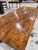 This is a dark elm wood dining table with tapered legs and amazing wood grain top. Many elm wood tables are light, but...