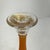 Art Deco orange and black pressed glass candlesticks in the manner of Charles Schneider. The candle holders have a...
