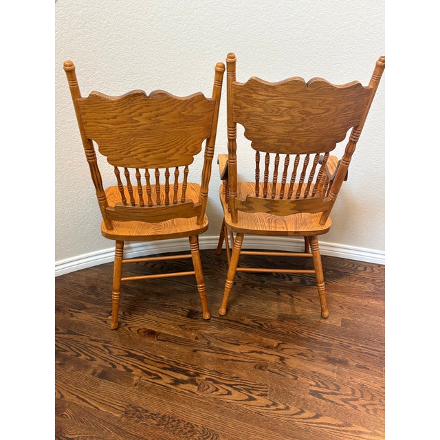 Vintage Carved Solid Oak Pressed-Back Dining Chairs – Captain & Side Chair Pair For Sale - Image 4 of 9