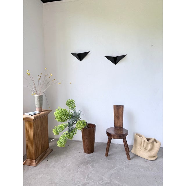 Pair of wall lights in slightly textured black metal. we love their futuristic, postmodern design. very elegant, they will...