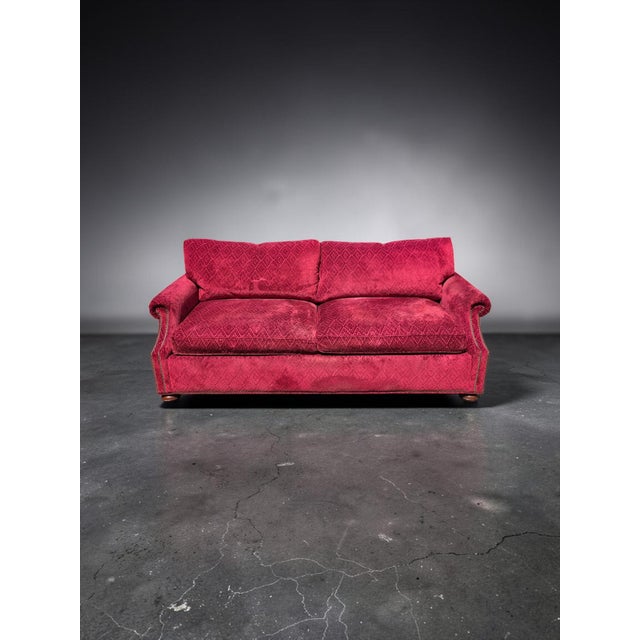 Theodore Alexander English Traditional crimson chenille rolled-arm sofa, distinguished by its generously proportioned...