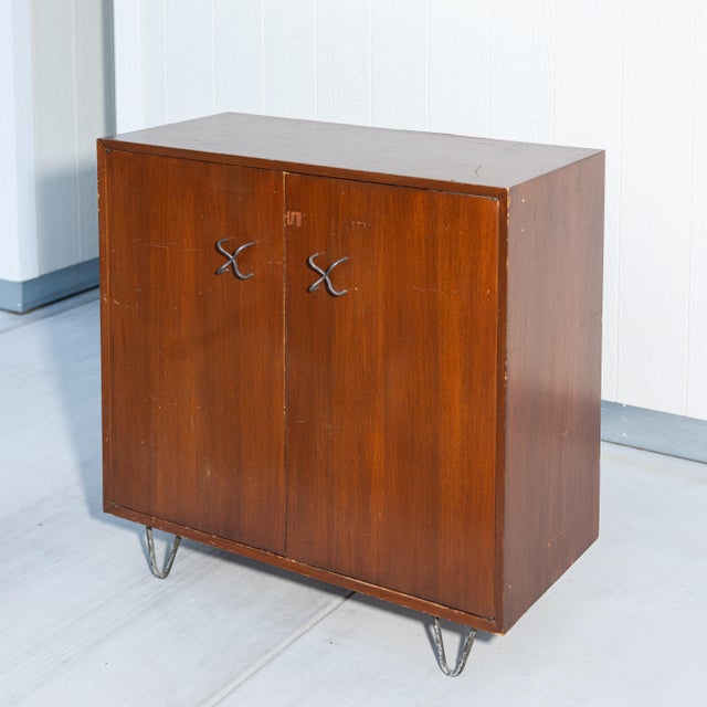 1950s George Nelson for Herman Miller Basic Cabinet Series (BCS) double-door credenza. Crafted in warm walnut, this early...