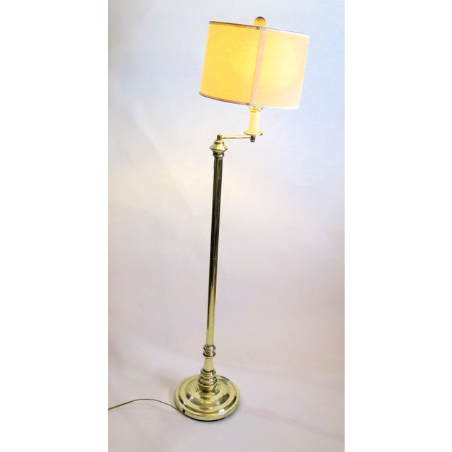 Back in the day, they made pieces to last through the ages. This Articulated flexible arm Walter Chapman floor lamp is a...