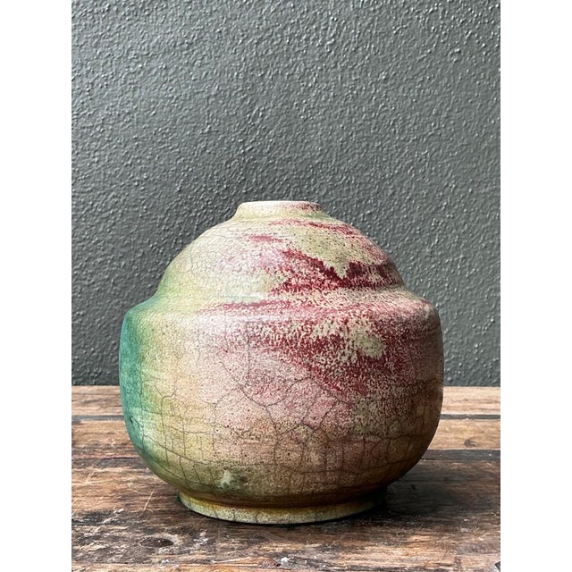 This evocative vintage ceramic vessel exemplifies the expressive spirit of mid-century abstract pottery, where form,...