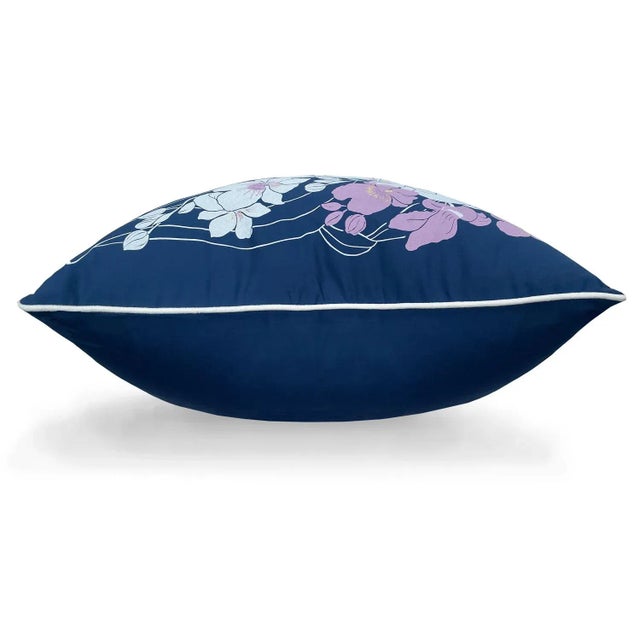 A cascade of orchids brings a delightfully tropical touch to any space 22" pillow, upholstery cotton twill with supersoft...