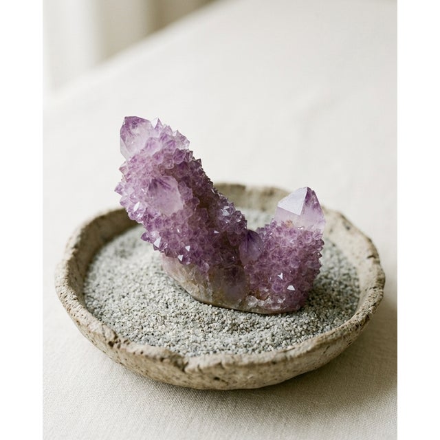 A small sculptural natural Spirit Quartz specimen selected for its soft lilac tone, central crystal point, and sparkling...