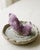 A small sculptural natural Spirit Quartz specimen selected for its soft lilac tone, central crystal point, and sparkling...