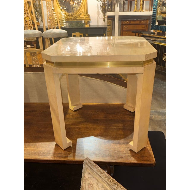 This product is a pair of Italian MCM parchment and brass side tables that are perfect for a stylish design. These tables...