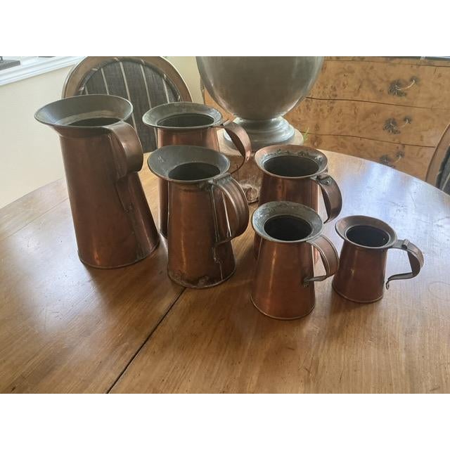 Classic set of antique copper measures - very slightly mismatched but looking great together for your kitchen or hearth...
