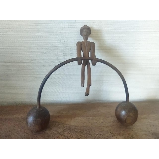 Beautiful rustic, vintage folk art balancing man on base with wood and finish. This kinetic, two piece sculpture (base and...