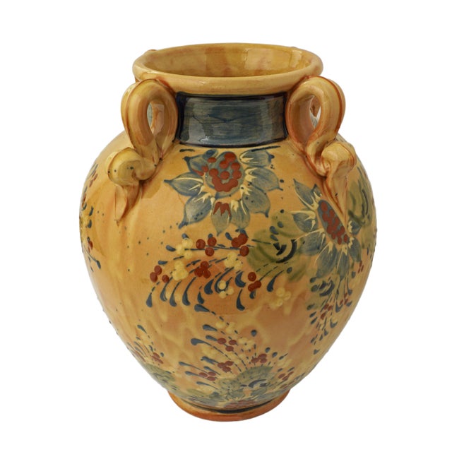French glazed terracotta urn that brings a warm, rustic Provencal touch to your space. Crafted from glazed terracotta, it...