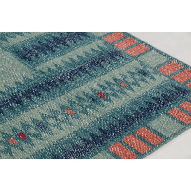 Hand-knotted in wool, this 9x12 contemporary rug joins Rug & Kilim’s Scandinavian collection. It features a plain teal-...