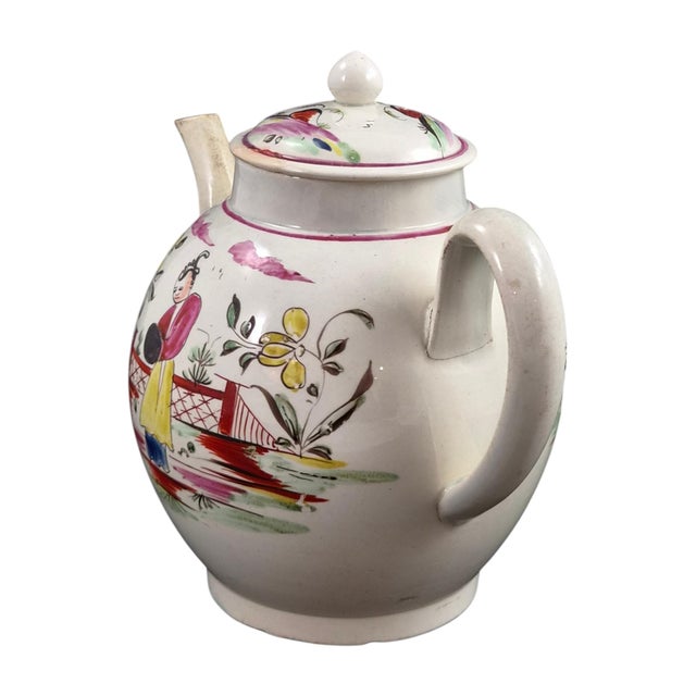 This rare late-18th-century teapot combines a balanced globular profile with lively hand-painted chinoiserie decoration...