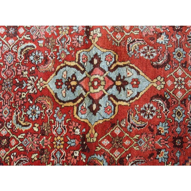 Handmade antique Bidjar rug from the beginning of 20th century. The rug is in original good condition made in red and blue...