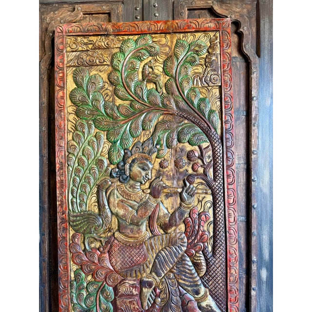 Bring home the divine charm of this Fluting Krishna with Deer Vintage Carved Wood Wall Art, crafted from a colorful...