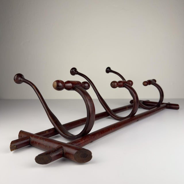 Antique Wooden Coat Rack made in Italy in the 1930s. Dimensions: Width: 77 cm / 30.3 inches Height: 37 cm / 14.6 inches...