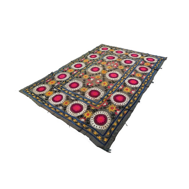 Suzani from Samarkand, Uzbekistan: 1960s/70s" encapsulates the essence of a textile piece originating from the region of...