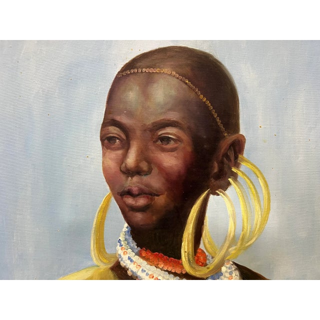 For your consideration: Strong and stately portrait of an African woman in traditional garb and ornaments. Original frame