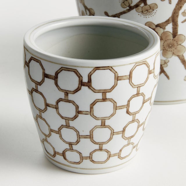 Classic chinoiserieinspired coordinating patterns in taupe andWhite. In design, taupe is often associated with muted,...