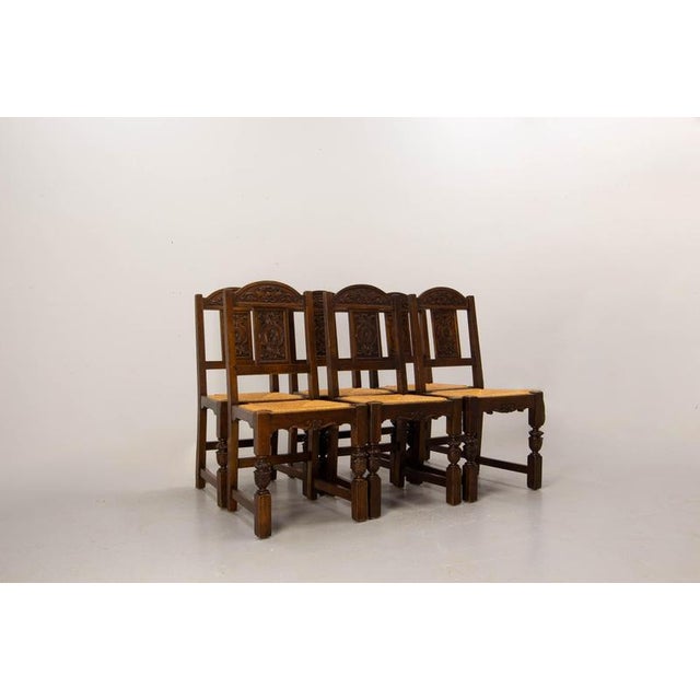 Set of six Spanish-style carved oak chairs, 1950s–1960s A set of six Spanish-style oak chairs dating from the 1950s–1960s....