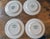 A set of four vintage Currier & Ives dinner plates featuring The Old Grist Mill from the Currier & Ives collection...