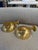 A refined pair of Italian wall sconces from the 1970s, crafted entirely in brass and defined by their sculptural, semi-...